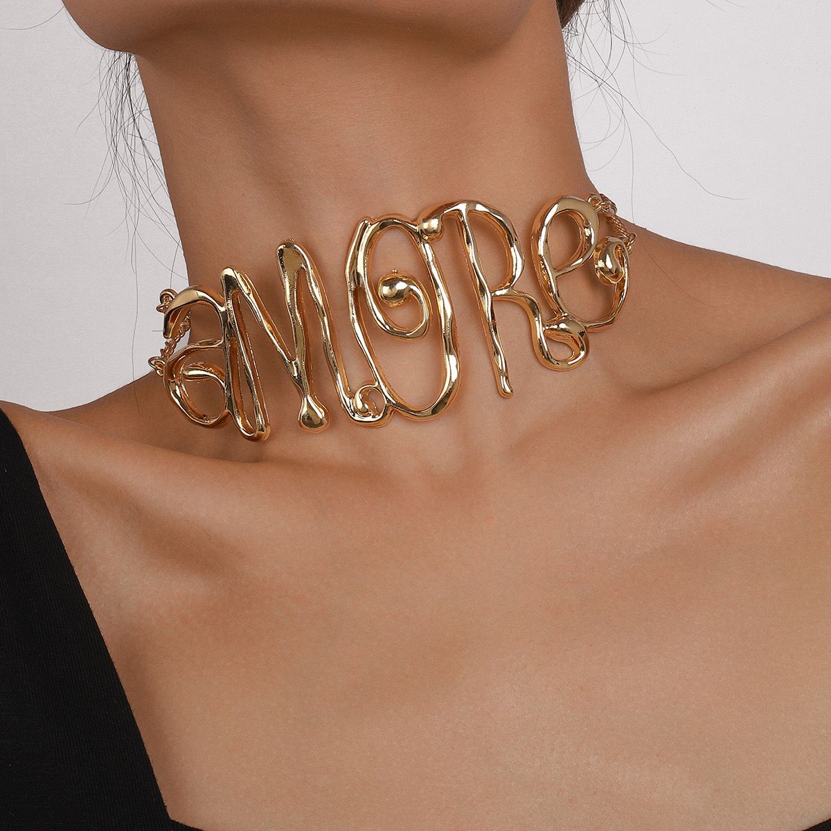 Letter women necklace in Gold
